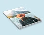 Softcover-Fotobuch mit Frau vor See und Bergen als Cover-Aufdruck
